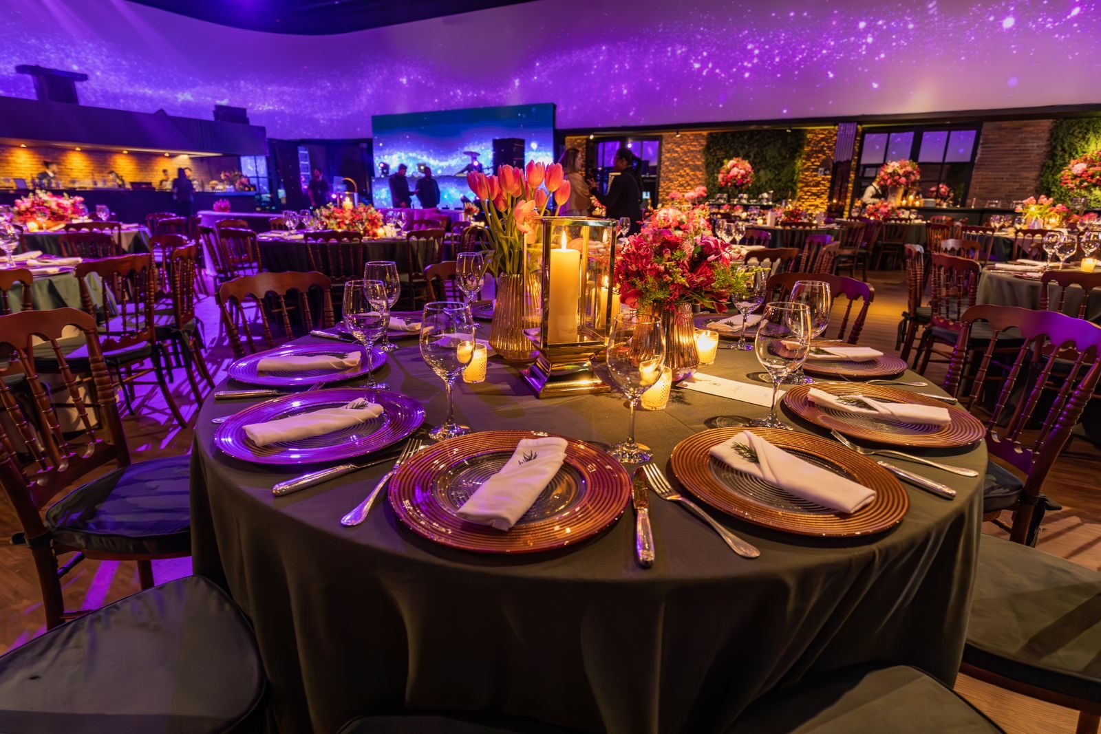 Candlelit gala dinner tables, the setting for many charity and cruise auctions online and in person